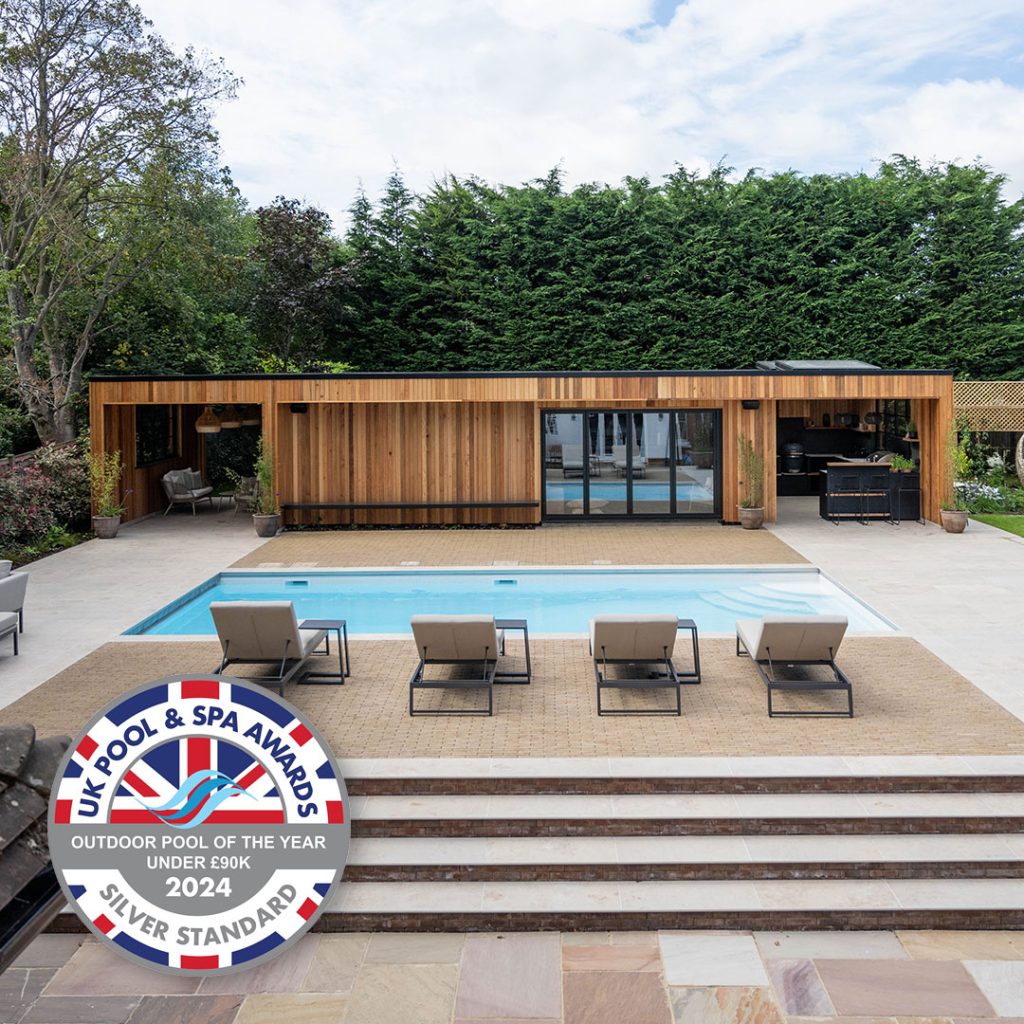Outdoor swimming pool with large wooden pool house